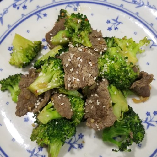 Beef and Broccoli with sesame seeds on top