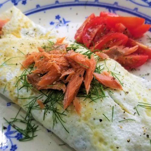 Smoked salmon omellete with fresh dill tomatoes dijon mustard and sour cream
