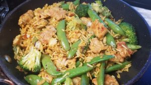 Stir Fry with chicken breast snap pea pods brocolli and jasmine rice